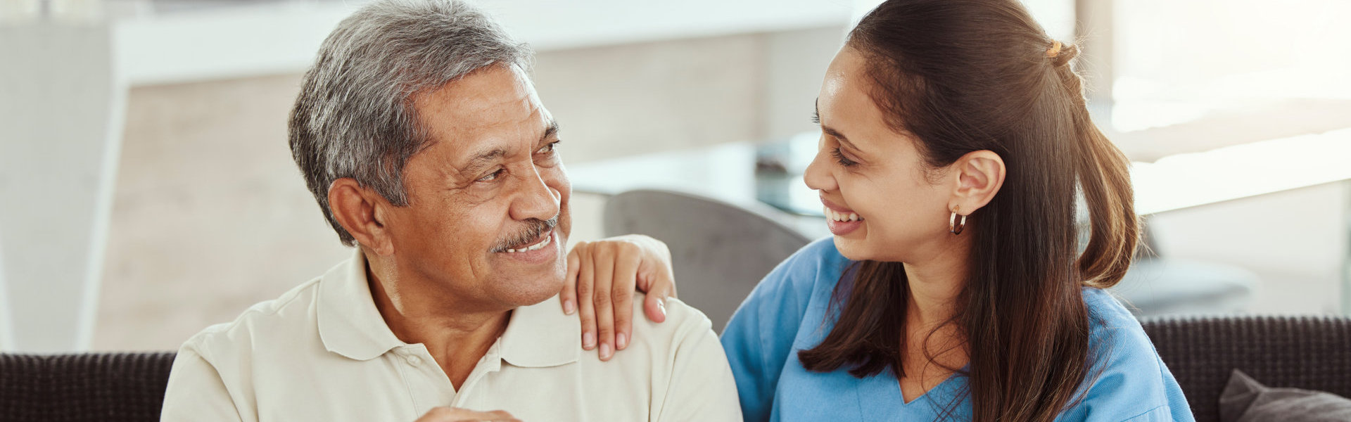 caregiver and her patient smiling